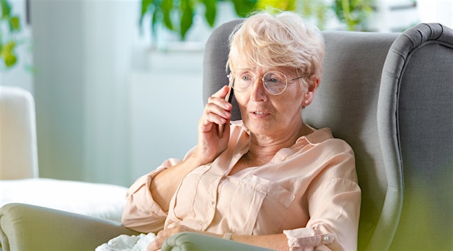 senior woman talking on the phone with medhelp telehealth virtual doctor appointment