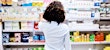 Woman looking at medicine and antibiotics
