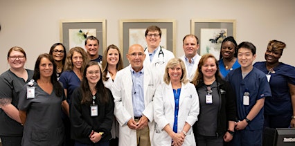 group of smiling doctors and nurses at medhelp birmingham urgent care and primary care